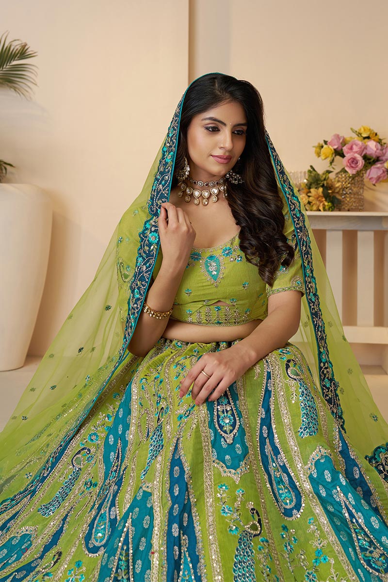 Royal Green Bridal Soft Net Lehenga with Peacock & Paisley Motifs and Heavy Embroidery