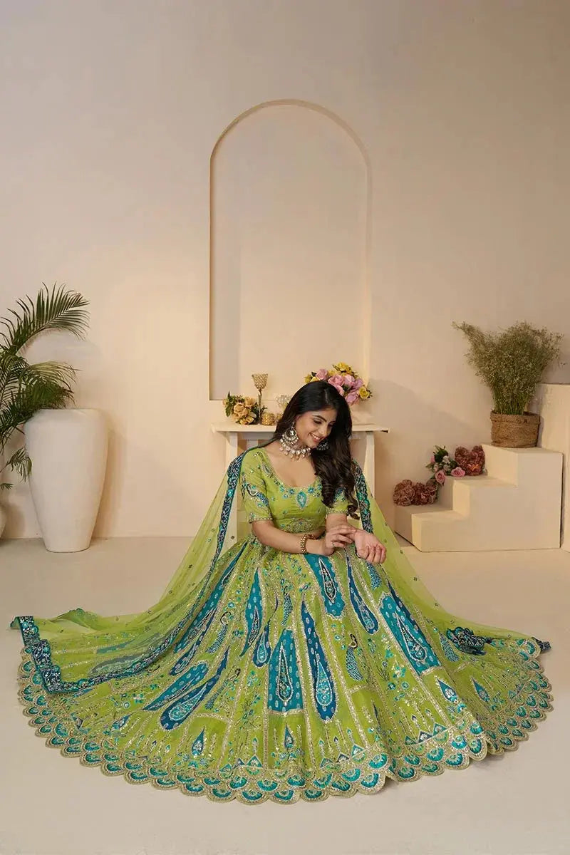 Royal Green Bridal Lehenga Soft Net Lehenga with Peacock & Paisley Motifs and Heavy Embroidery