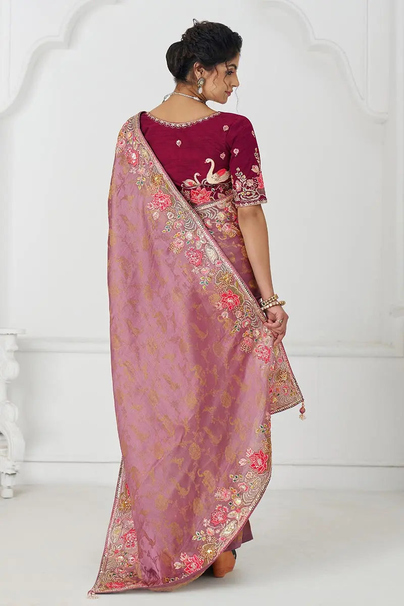 Threaded Blossoms: Pink Saree with Colorful Floral Embroidery